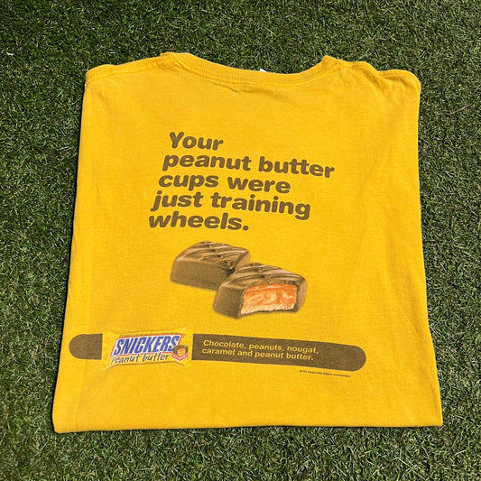 Y2K Snickers Training Wheels Yellow Tee Size XL USED v16584