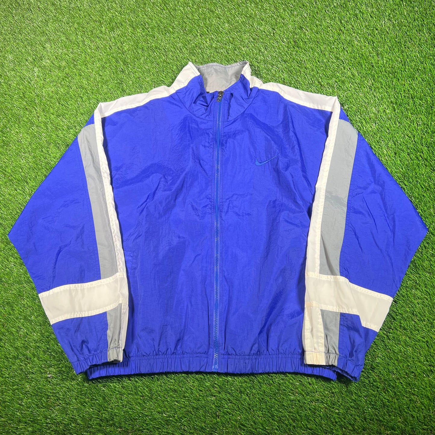 1990s Nike Blue/White Broken Swoosh Windbreaker Size Medium USED v18114