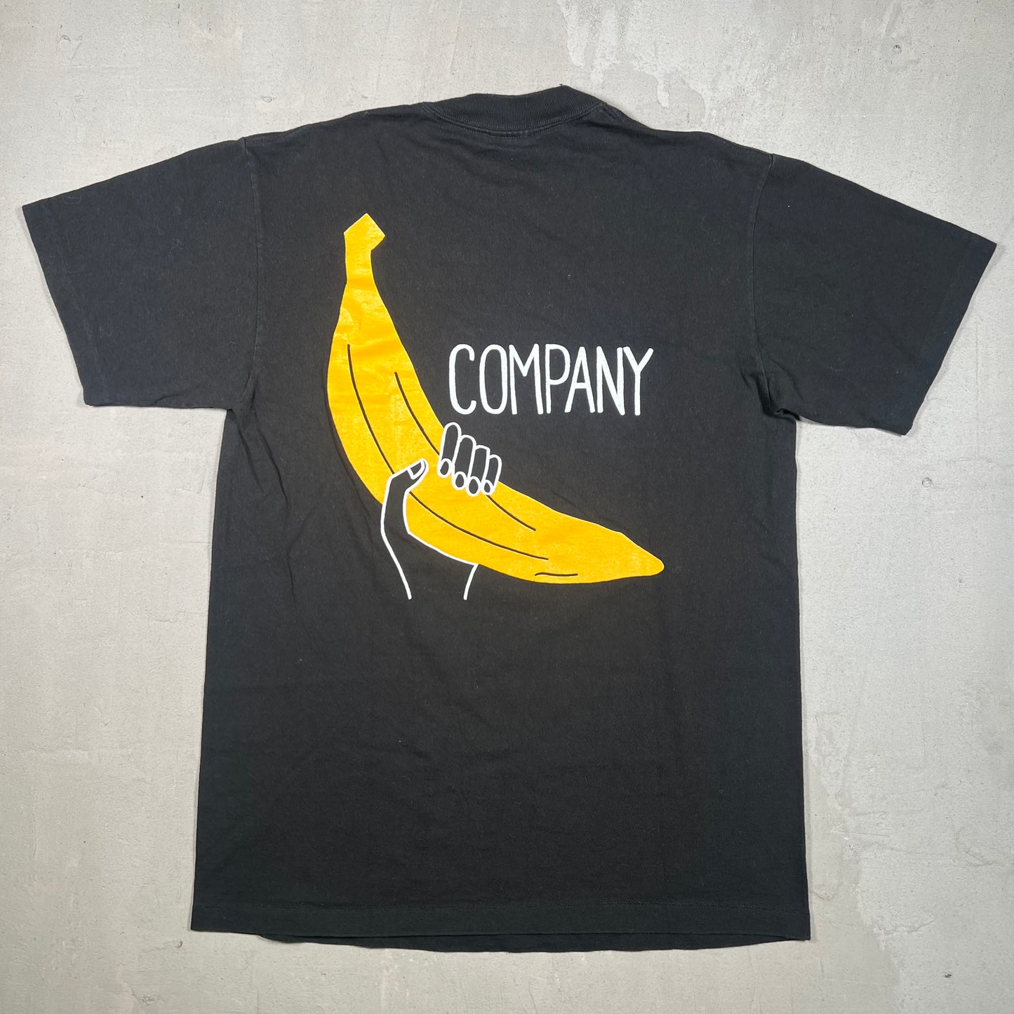 1987 Big Banana Holding Company Black Tee Size Medium USED v19300