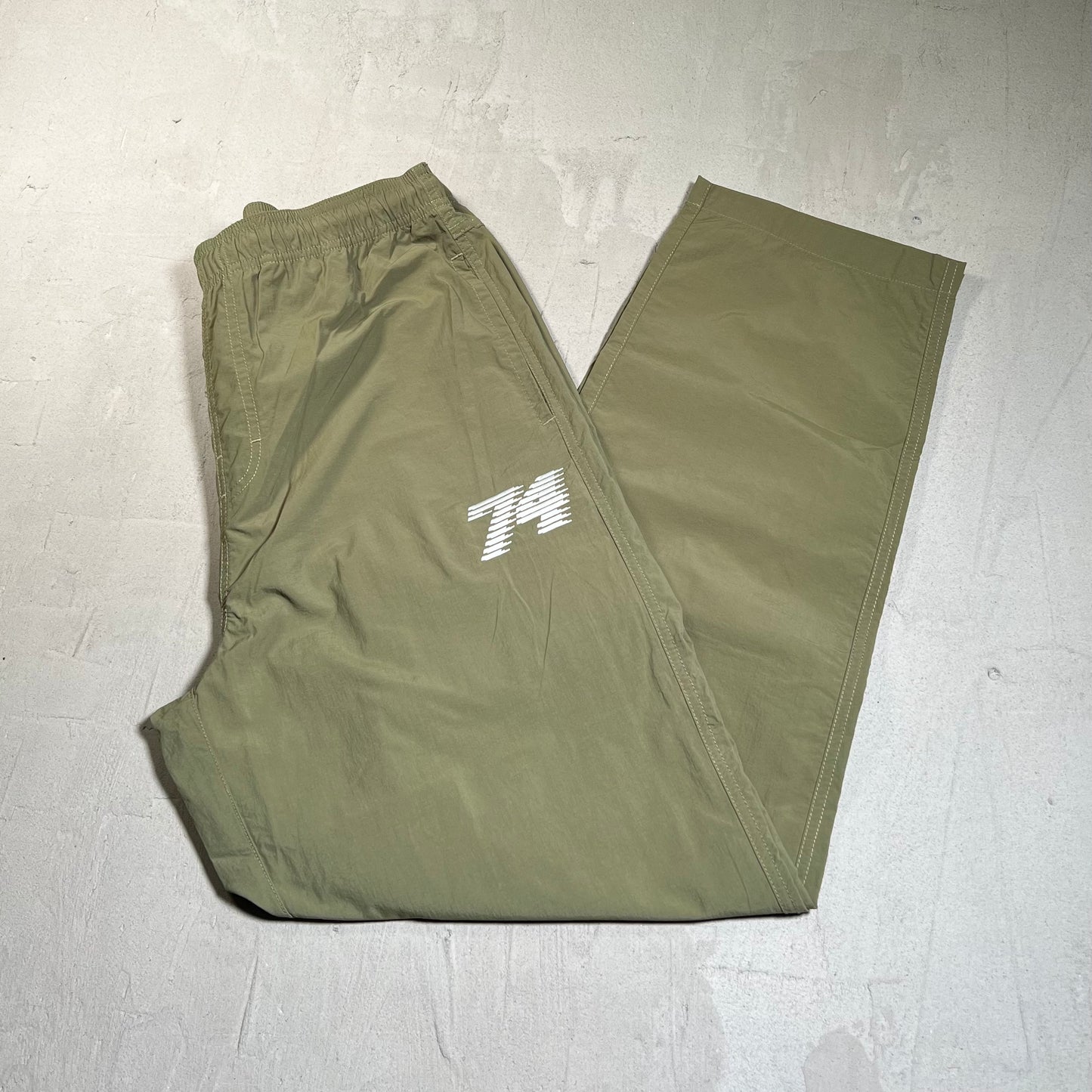 74 is War BGC Olive Green Racer Nylon Pants Size Large USED x17686