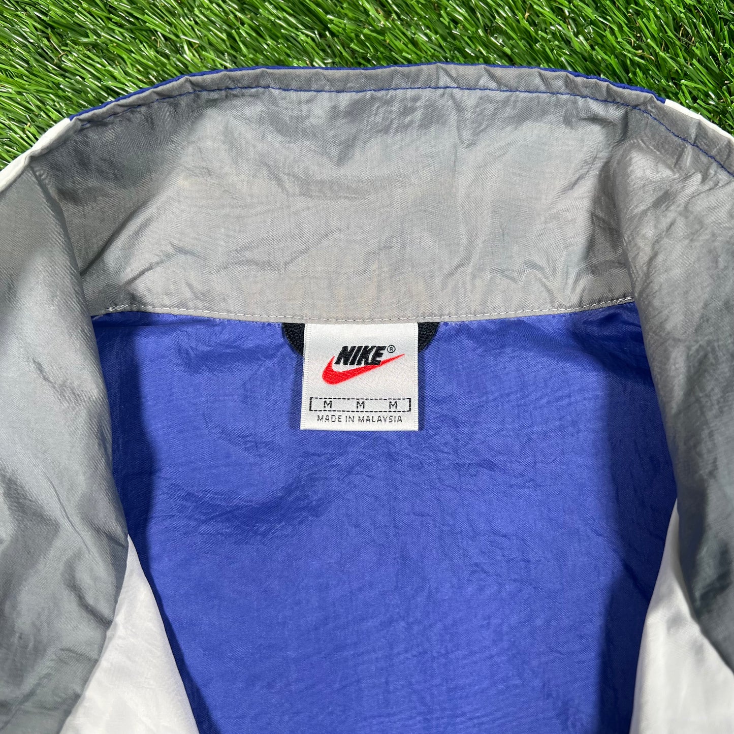 1990s Nike Blue/White Broken Swoosh Windbreaker Size Medium USED v18114