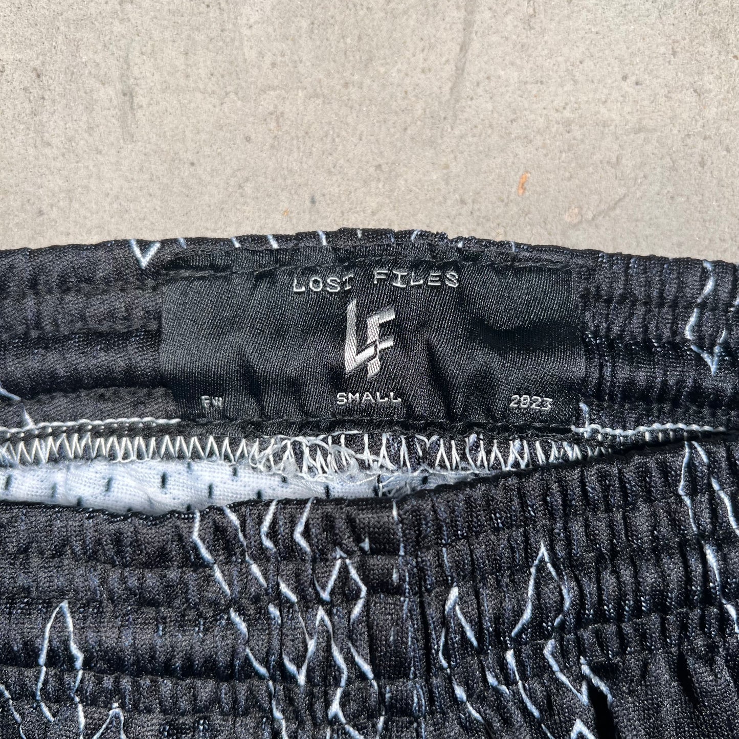 Lost Files Mesh Shorts Black Repeat Logo AOP Size Small USED v19422