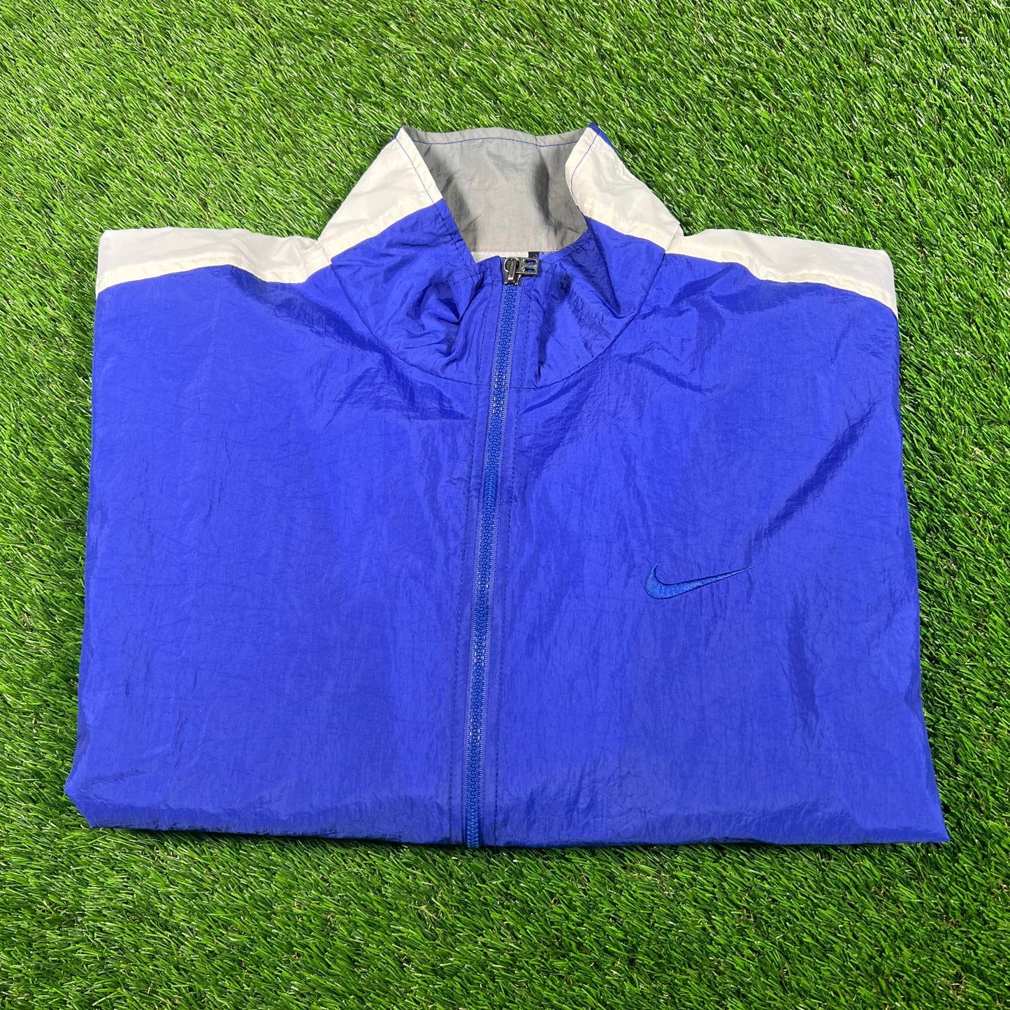 1990s Nike Blue/White Broken Swoosh Windbreaker Size Medium USED v18114