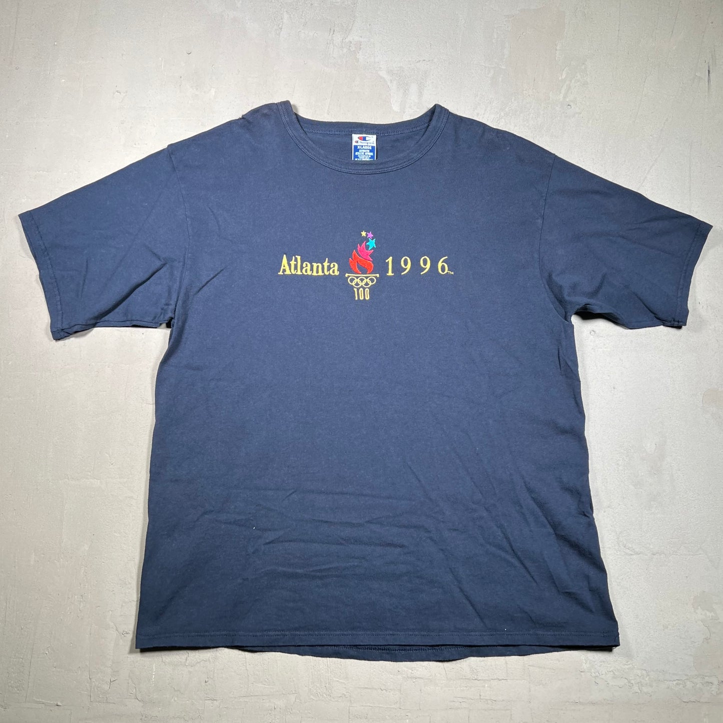 1996 Atlanta Olympic Champion Tag Navy Blue Tee Size XL USED v16378